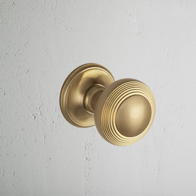 Poplar Sprung Door Knob - Antique Brass