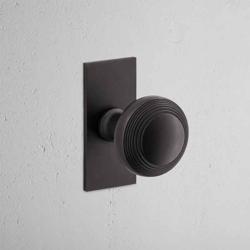 Poplar Short Plate Sprung Door Knob - Bronze