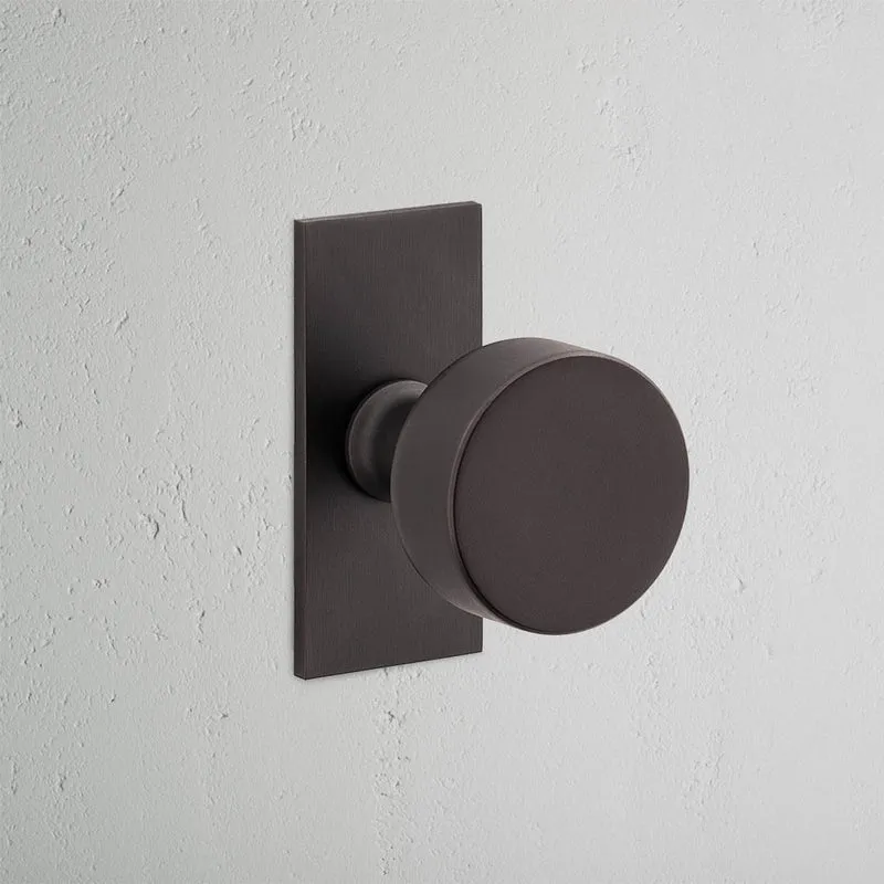 Onslow Short Plate Sprung Door Knob - Bronze