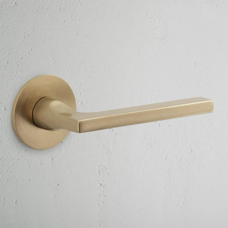 Clayton Fixed Door Handle With Flush Rose - Antique Brass