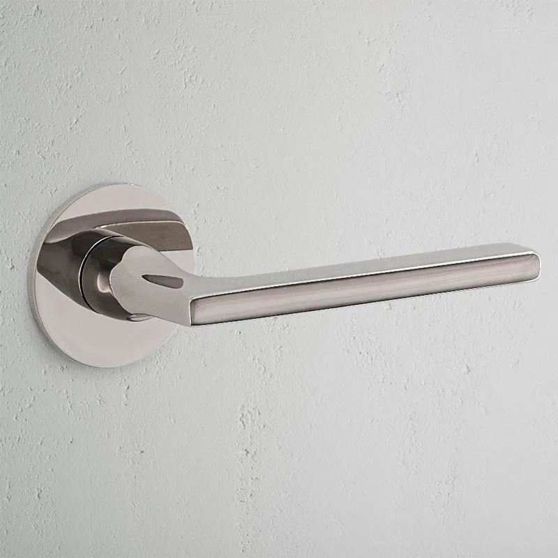 Clayton Sprung Door Handle With Flush Rose - Polished Nickel
