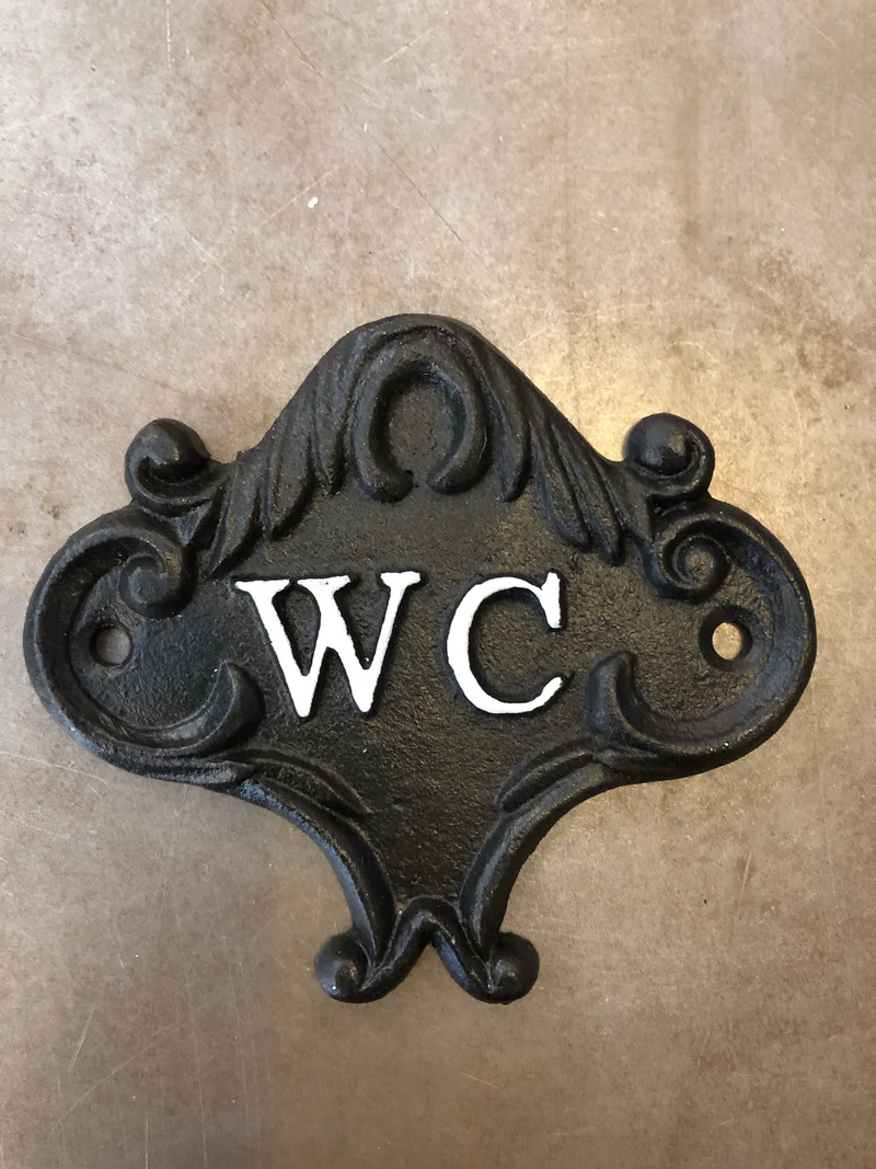 WC-skylt gjutjärn